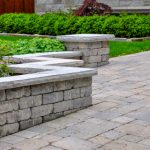 A,Seat,Wall,With,Pillars,And,Natural,Stone,Coping,Helps