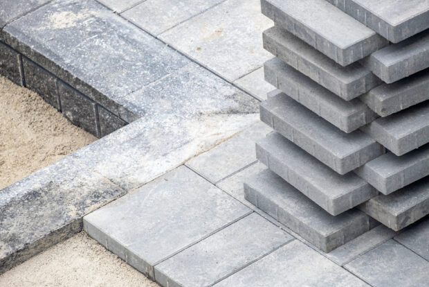 Pavers vs. Natural Stone: Which Hardscaping Material is Right for Your Project?